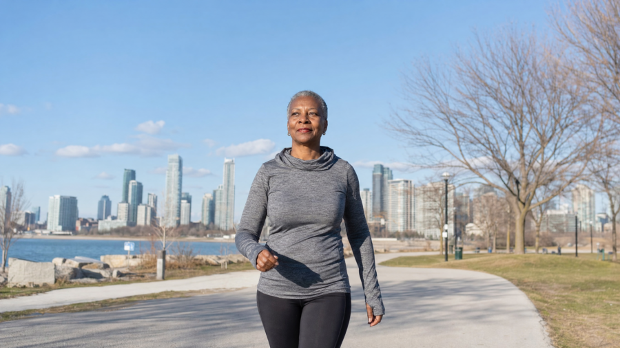 Older woman walking on a park trail