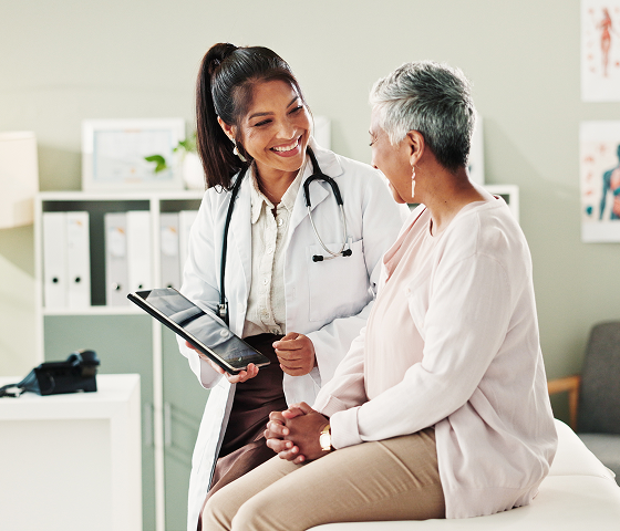 Doctor and the patient looking at the health report
