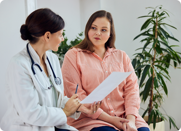 Doctor consulting with a patient in a clinic office